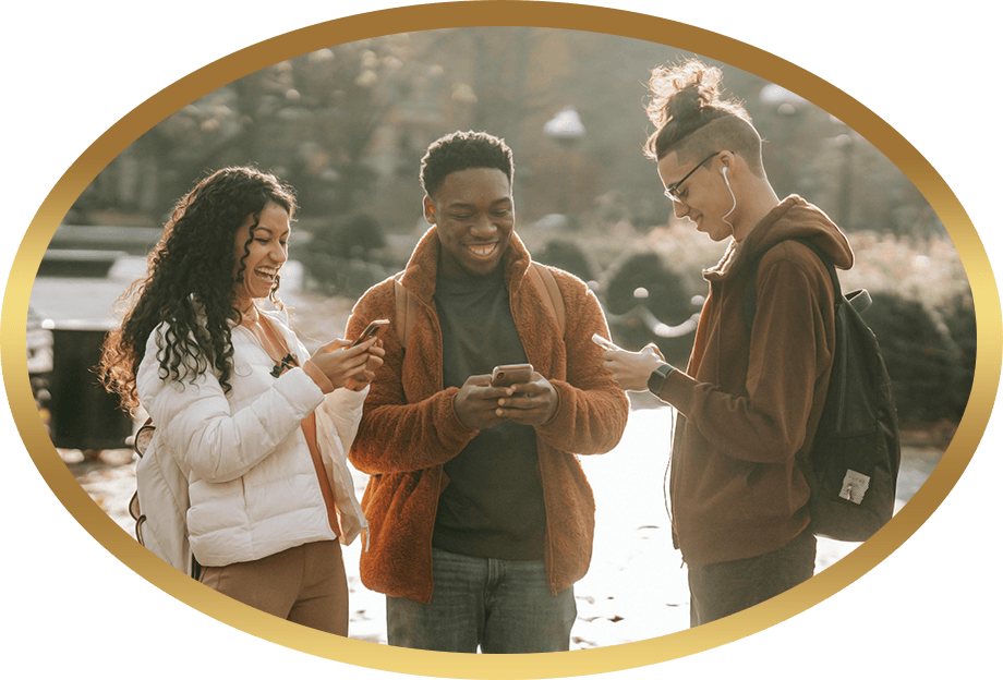 A group of students looking at their phones